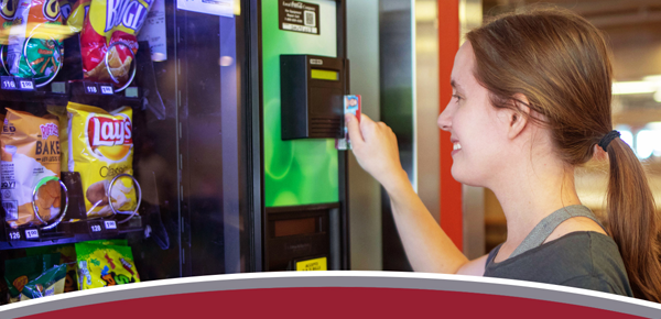 student at vending machine