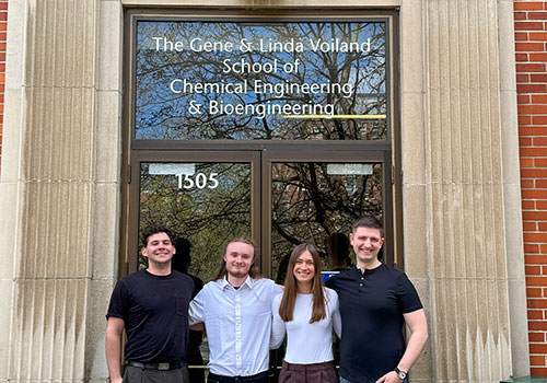 Ori Navah, Roan Gates, Kendall Lyons, and Tyler Boies standing in front of Voiland building entrance.