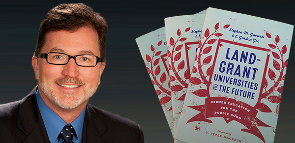 Closeup of Stephen Gavazzi and his book, 'Land-Grant Universities for the Future'.