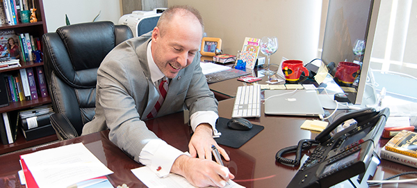 Dean Tomkowiak calls a student to offer admission