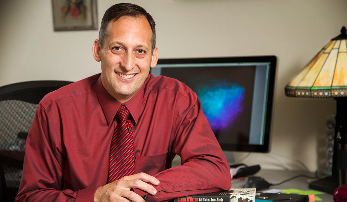 Close-up of Matthew Jockers sitting at a desk.