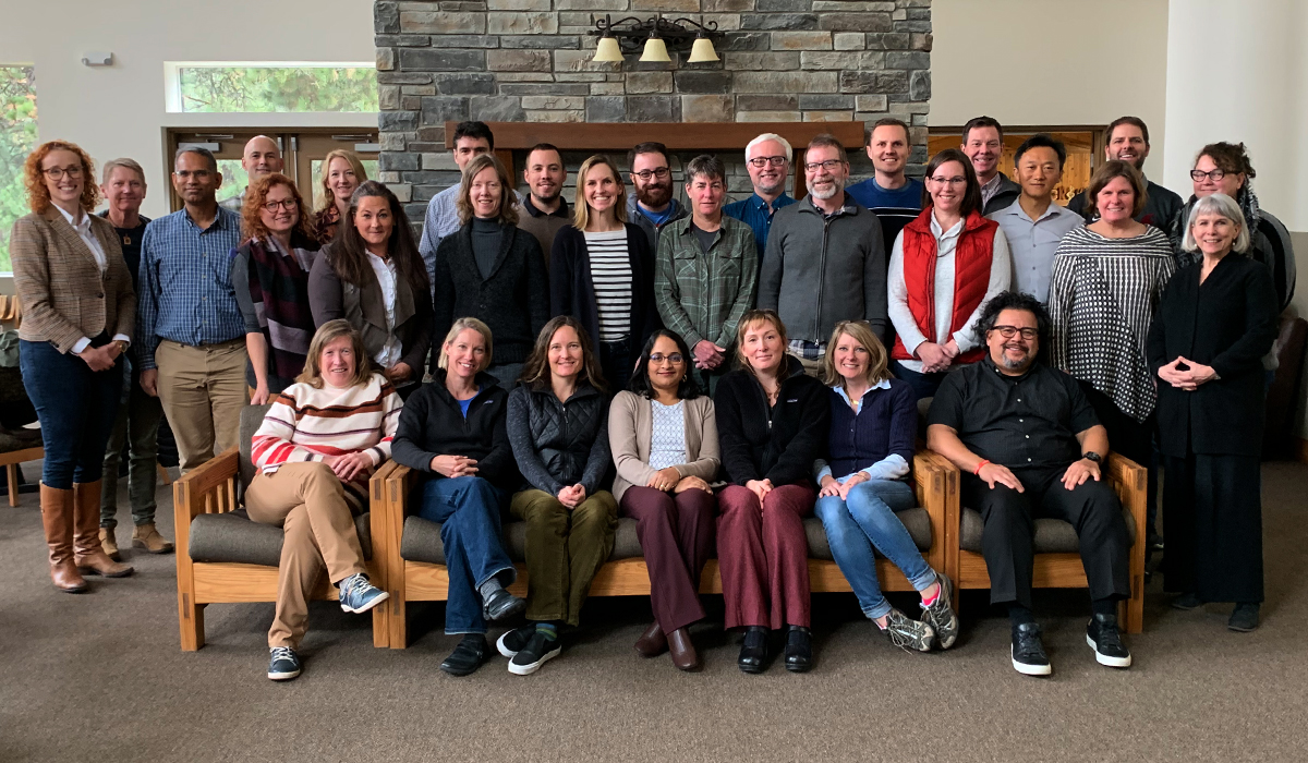 Retreat attendees gather for a group photo at Ross Point.